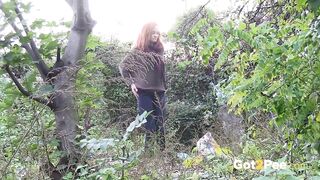 Redheaded Babe Pisses Long And Hard In Trees