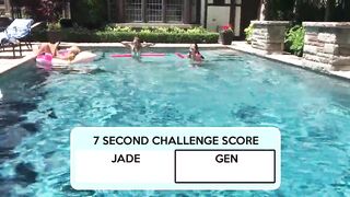 Two Bikini Teens challenging each other in pool