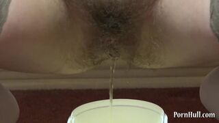 Brunette with a very Hairy Pussy Urinates