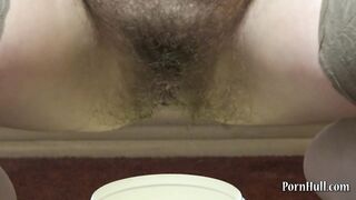 Brunette with a very Hairy Pussy Urinates