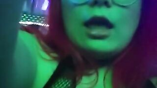 girl dances to loud club music wearing only a mesh top