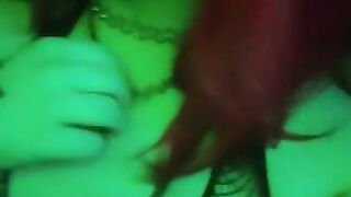 girl dances to loud club music wearing only a mesh top