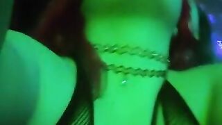 girl dances to loud club music wearing only a mesh top