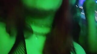 girl dances to loud club music wearing only a mesh top