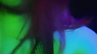 girl dances to loud club music wearing only a mesh top