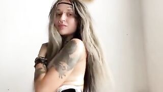 tattooed girl caresses herself