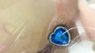 Cutie plays with butt plug and teases you with wet pussy and ass through glass