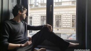 Naked guy jacking off and cumming on windowsill next to busy street