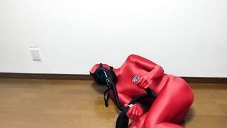 Respiratory control with gas mask on red zentai