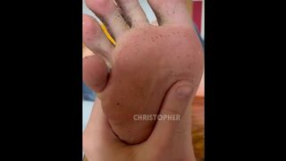 Slave licks dirty feet of sand