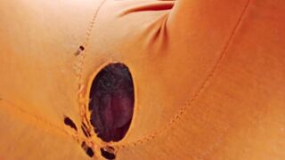 Indian girl working from home with hole in her pants. Under table view.