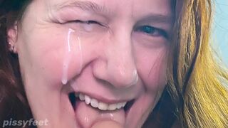 Milf takes surprise cumshot in the eye after masterful blowjob.