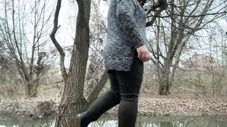 Doggystyle pissing of a woman who wears pantyhose under her pants