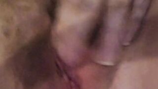 Horny housewife fingers herself to orgasm.