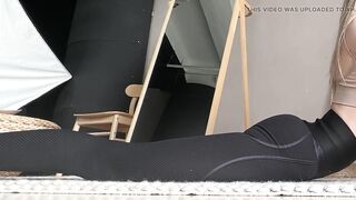 barefoot stretching in tight leggings