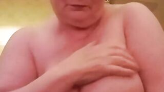 Hot Granny Plays With Her Giant Boobs Trying To Entice You