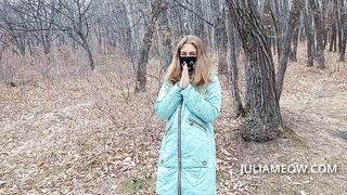 Exhibitionist girl undresses in the autumn forest