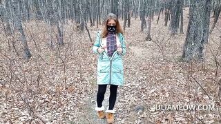 Exhibitionist girl undresses in the autumn forest