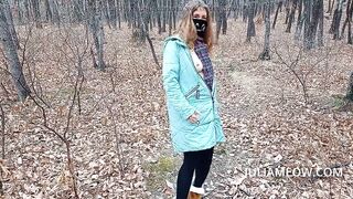 Exhibitionist girl undresses in the autumn forest