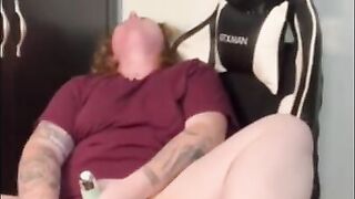 Amateur redhead masturbates in husbands gaming chair while he's at work